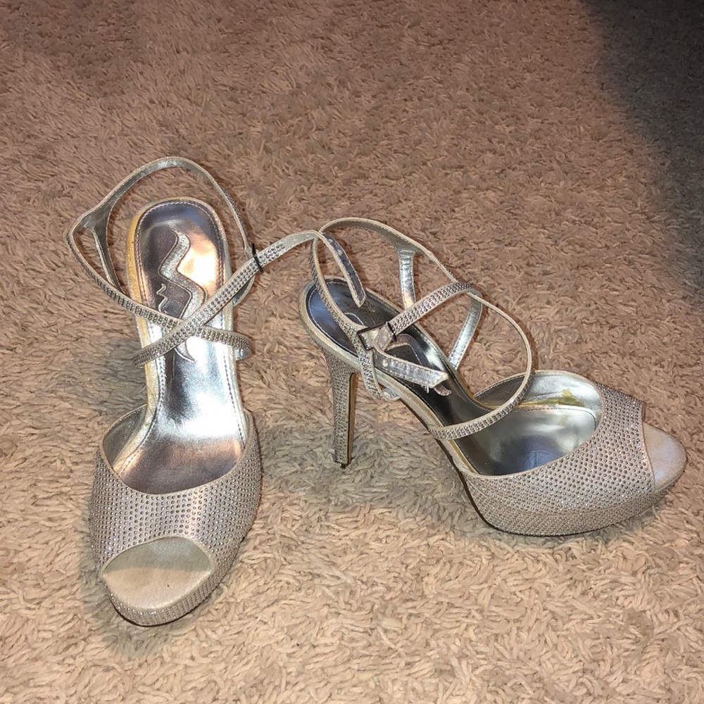 Silver heels with gems.